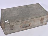 an old suitcase that is sitting on a white surface