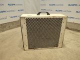 an old air conditioner sitting on the floor in front of a wall