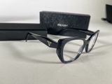 the pair of glasses are sitting on the table next to the box