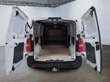 a white van with its doors open in a room