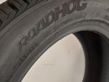 a close up of a tire on a white surface