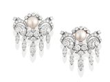 a pair of pearl and diamond earrings