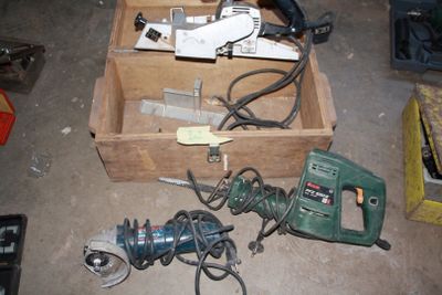 a box of tools that are sitting on the floor