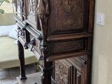 a wooden cabinet in the corner of a room