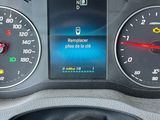 a close up of a car dashboard with a speedometer