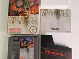 three video games on a table with a book