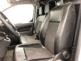 the interior of a truck with a black seat and a black seat belt