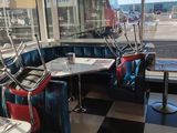 a black and white checkered floor in a diner