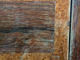 a close up of a wooden door with a wooden handle