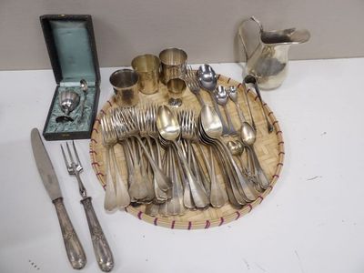 a tray with silverware on it on a table