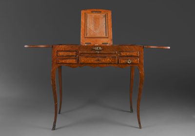 a wooden desk with a mirror on top of it