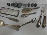 many different types of silverware on the table