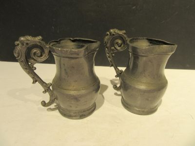 pair of antique silverplated pewware pitchers with handles