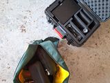 a suitcase with a gun inside of it sitting on the floor
