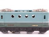 a toy train on a white surface with a white background
