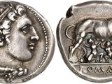 une pièce d'argent sur laquelle figurent une femme et un taureau