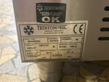 the label on the back of a stainless steel water heater is clearly visible