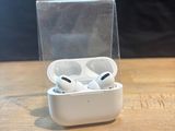 a box with two airpods in it sitting on a table