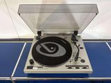 a record player sitting on top of a blue table