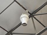a white light that is on the ceiling of a building