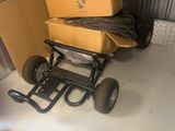 a small cart with a box on it in a garage