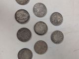 a lot of coins that are sitting on a table