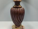 a lamp that is sitting on a table next to a lamp shade