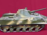 a picture of a model of a tank on a red background