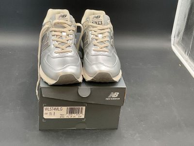 pair of new balance shoes in a box on a table