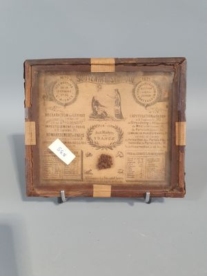 a picture of a small wooden box with a label on it