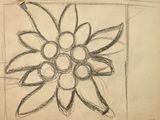a drawing of a flower on a piece of paper