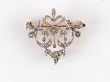 une image représentant une broche en forme de diamant sur fond blanc