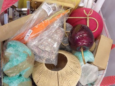 a basket full of craft supplies that is sitting on a table