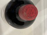 a bottle of wine that is sitting on a counter