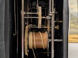 a clock that is inside of a black case