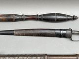 three different types of knives and a knife holder on a table