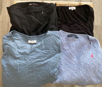 three shirts on a wooden hanger on a wooden floor