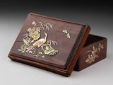 an image of a wooden box with a bird and flowers on it