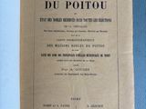 an open book on a blue table with a black and white title