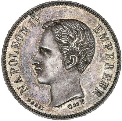 une pièce d'argent sur laquelle figure la tête d'un homme coiffée d'une couronne