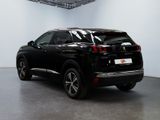 the rear end of a black suv parked in a garage