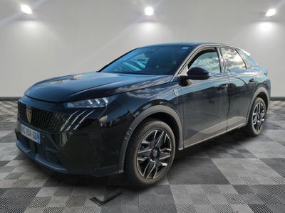 a black car parked in a room with a checkered floor