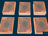 four decks of playing cards are arranged in a row on a blue background