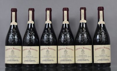 six bottles of wine are lined up in a row on a table