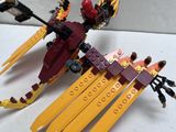 a lego dragon that is sitting on top of a table