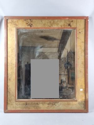 a picture of a mirror hanging on the wall