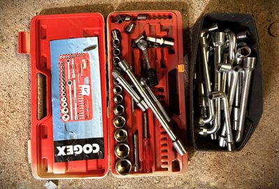 many tools in a red case on the floor