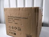 a box that is sitting on a table in front of a wall