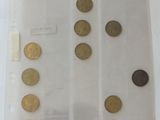 a lot of coins in a plastic bag on the table