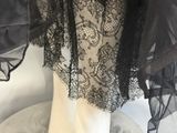 black lace overlayed dress on mannequin mannequin mannequin mannequin mannequin mannequin mannequin mannequin mann